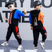 Boy wearing a Korean spring long-sleeved sports suit by Ancient Energy, featuring a two-piece set with casual, comfortable design.
