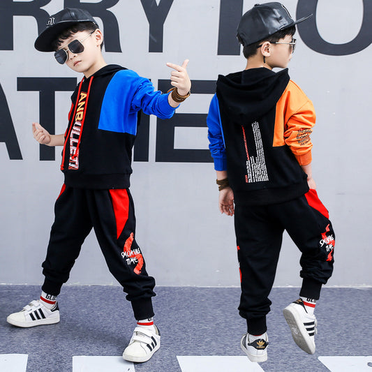 Boy wearing a Korean spring long-sleeved sports suit by Ancient Energy, featuring a two-piece set with casual, comfortable design.