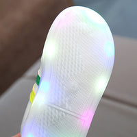 White LED sneakers from Ancient Energy featuring stylish design and illuminated soles, perfect for casual and trendy looks.