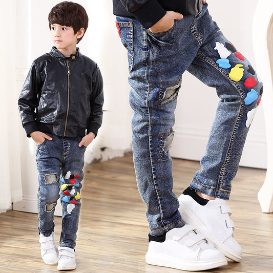 Boy jeans from Ancient Energy featuring a classic fit with denim fabric and five-pocket design, displayed on a neutral background.