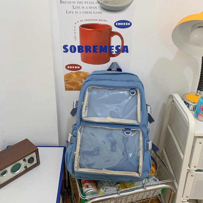Cute middle and high school students' schoolbag from Ancient Energy with colorful design and adjustable straps on a white background.