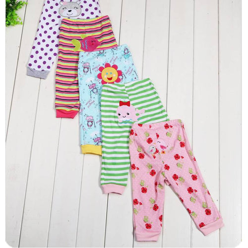 Set of five children's leggings with colorful cartoon print by Ancient Energy, featuring playful patterns and comfortable fabric.
