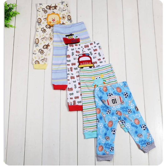 Set of five children's leggings with colorful cartoon print from Ancient Energy, featuring playful patterns and soft fabric.