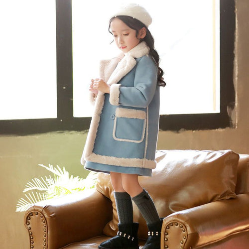 Colorful winter children's clothing set by Ancient Energy, featuring a cozy jacket, pants, and accessories for cold weather.