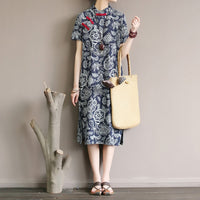Mandotos International retro floral cotton dress with side slit, featuring a vibrant floral pattern and classic fit.