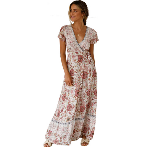 Tropical Bloom Maxi Dress by Mandotos International featuring vibrant floral print and flowing fabric.