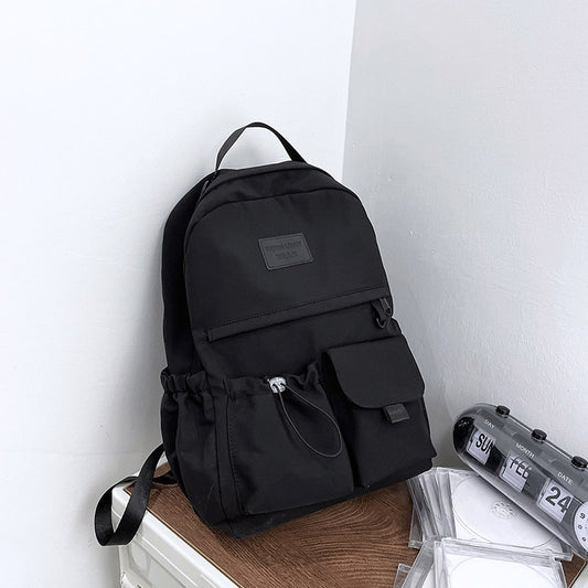 Ancient Energy nylon backpack for junior high school students, featuring multiple compartments and adjustable straps.