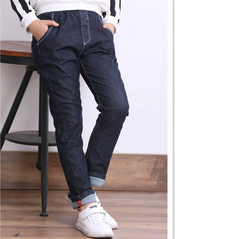 Children's boys' jeans with thick fleece lining, winter casual wear by Ancient Energy, showing denim pants for kids in a cozy setting.