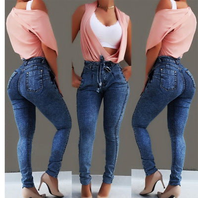 Ancient Energy fringed jeans featuring distressed denim and frayed hems, displayed on a neutral background.