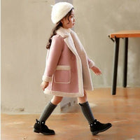 Children's winter clothing set by Ancient Energy featuring a warm coat, hat, and gloves for cold weather.