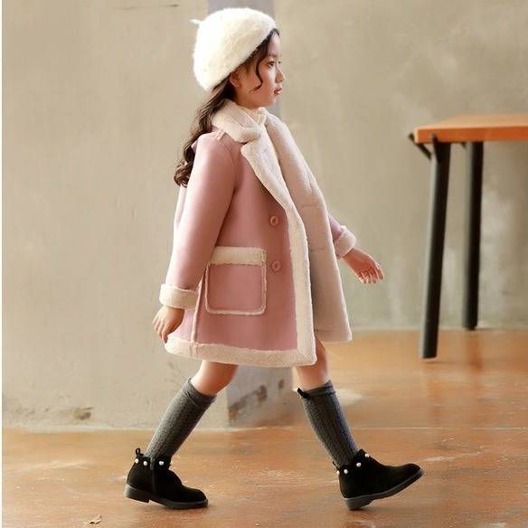 Children's winter clothing set by Ancient Energy featuring a warm coat, hat, and gloves for cold weather.