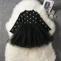 Baby girl wearing a lace tutu dress from Ancient Energy, perfect for spring, winter, or special occasions like birthdays or christenings.