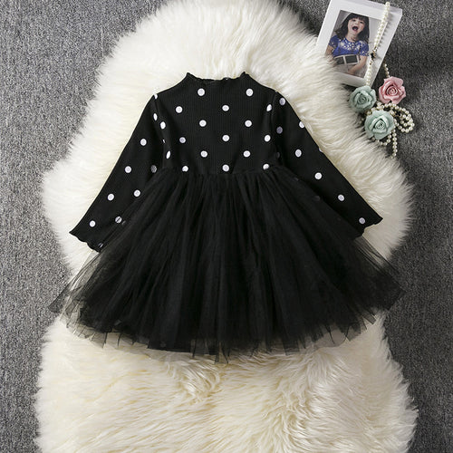 Baby girl wearing a lace tutu dress from Ancient Energy, perfect for spring, winter, or special occasions like birthdays or christenings.