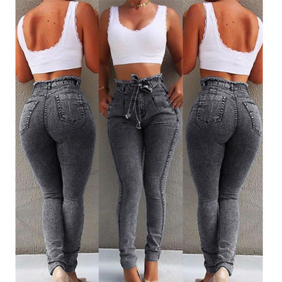 Ancient Energy fringed jeans with distressed denim and fringe details, front view showing stylish casual wear.