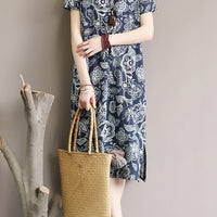 Mandotos International retro floral cotton dress with side slit, featuring a vibrant floral pattern and flowing silhouette.