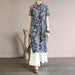 Mandotos International retro floral cotton dress with side slit, featuring a vintage-inspired design and vibrant flower pattern.