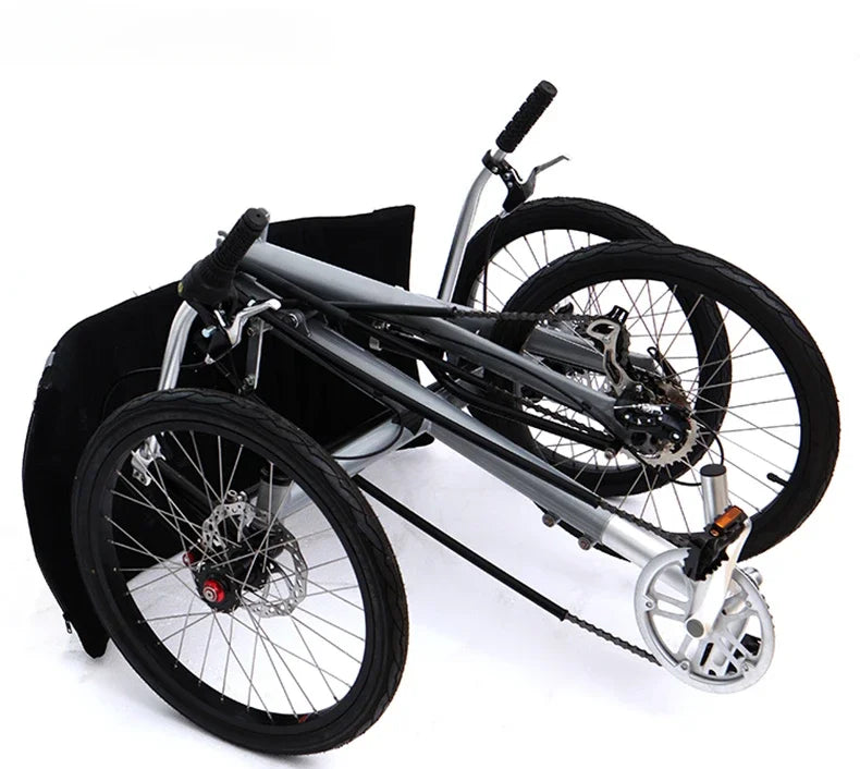 Lying on a tricycle, 3 shifting disc brakes, folding on a recumbent bike, casual commuting, riding a recumbent bicycle
