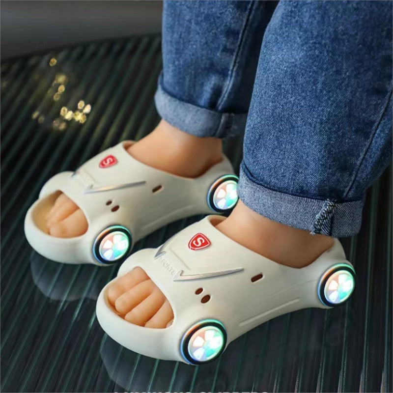 Kids glowing cartoon car slippers by Ancient Energy, slip-on luminous children’s beach sandals with anti-slip soles for boys and girls.