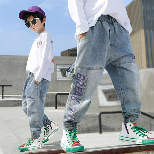 Boys' loose western-style jeans and trousers by Ancient Energy, suitable for primary school students, shown in a casual fit.