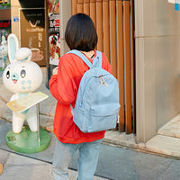 Ancient Energy corduroy backpack with shoulder straps, designed for students, featuring a stylish school bag in brown fabric.