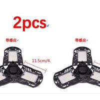 Ancient Energy 60W deformable LED light illuminating gym, warehouse, or garage with 6000 lumens brightness.