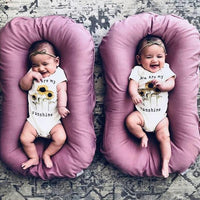 Ancient Energy baby nest bed crib with soft cotton cushion, portable infant cradle for newborns and travel convenience.