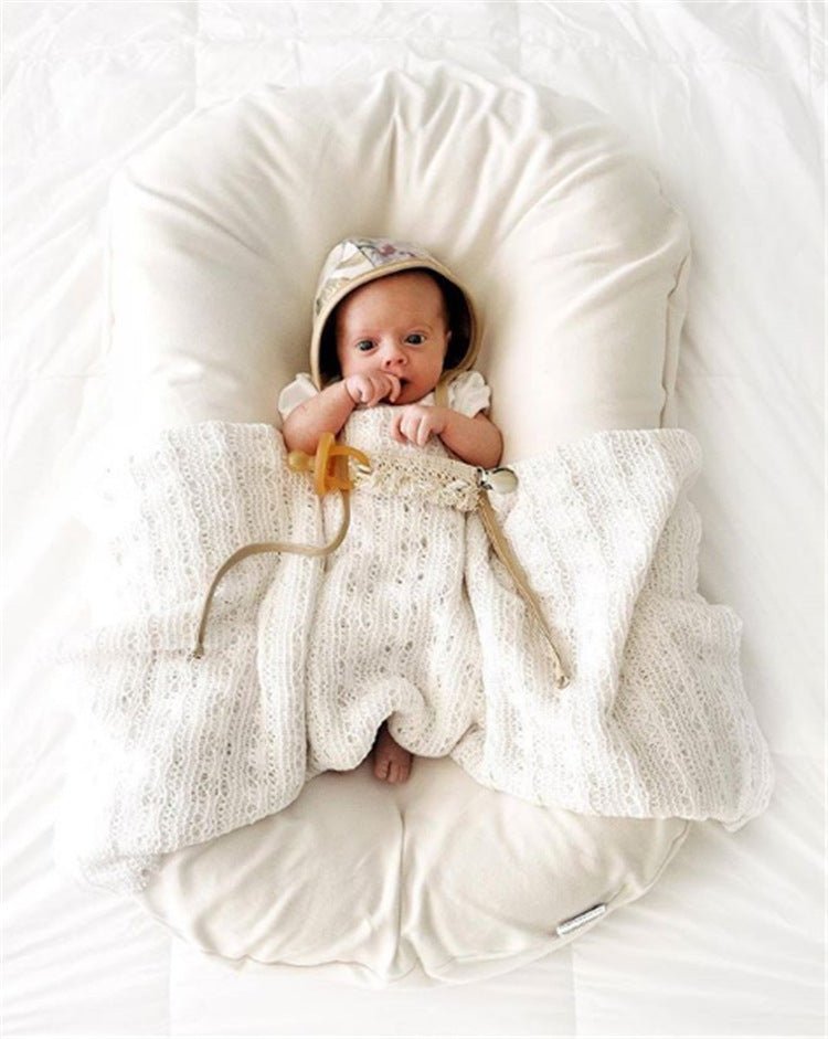 Ancient Energy baby nest bed crib for newborns, portable cotton infant cradle with cushion for travel and comfort.