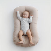 Ancient Energy baby nest bed and crib for newborns, portable cotton infant cradle with soft cushion for travel and cozy sleeping.