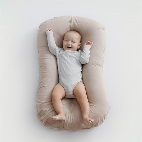 Ancient Energy baby nest bed and crib for newborns, portable cotton infant cradle with soft cushion for travel and cozy sleeping.