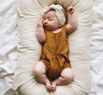 Ancient Energy baby nest bed and crib for newborns, portable cotton infant cradle with cushioned sides for cozy comfort.