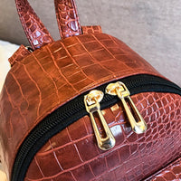 Casual Wild Women's Small Backpack by Ancient Energy featuring a compact design with adjustable straps and a stylish pattern.