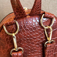 Casual Wild Women's Small Backpack by Ancient Energy, featuring a compact design with adjustable straps and a stylish pattern.