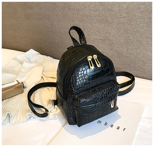 Casual Wild Women's Small Backpack by Ancient Energy, featuring a stylish design with adjustable straps and compact storage.