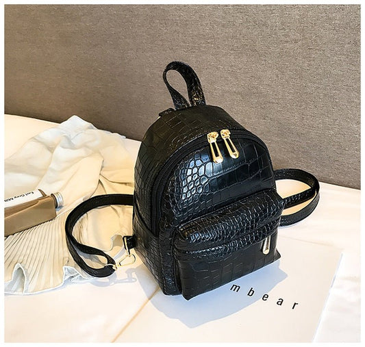 Casual Wild Women's Small Backpack by Ancient Energy, featuring a stylish design with adjustable straps and compact storage.