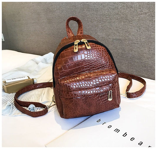 Ancient Energy casual women's small backpack with wild print design, featuring adjustable straps and compact storage space.