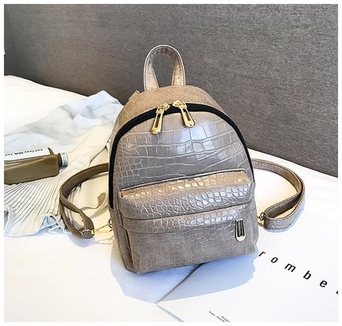 Casual Wild Women's Small Backpack by Ancient Energy, featuring a compact design with adjustable straps and a stylish, outdoor-inspired look.