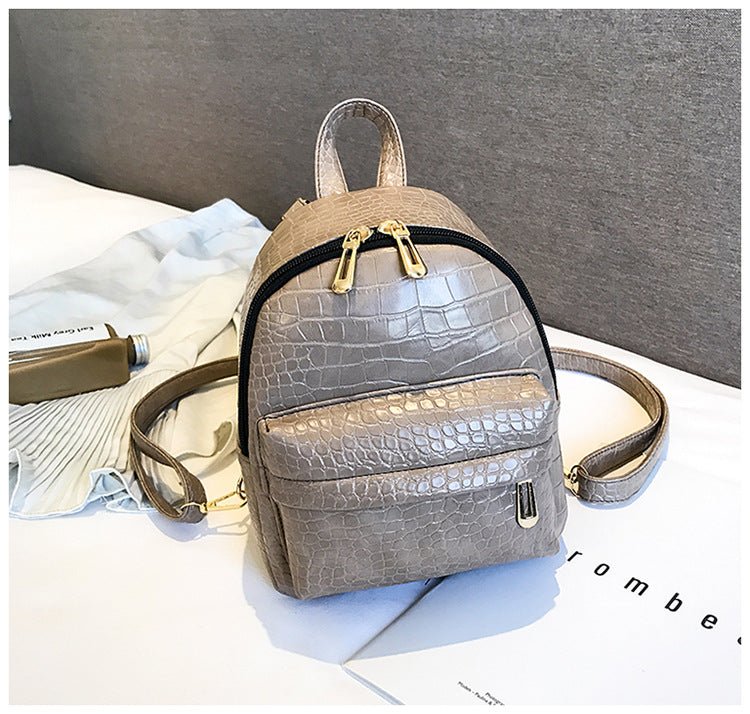 Casual Wild Women's Small Backpack by Ancient Energy, featuring a compact design with adjustable straps and a stylish, outdoor-inspired look.