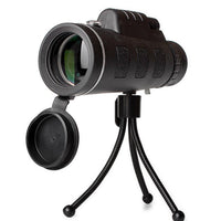 Ancient Energy compatible monocular telescope with zoom, built-in compass, phone clip, and tripod for outdoor viewing activities.