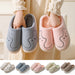 Ancient Energy cozy striped cat slippers for couples, indoor non-slip plush house shoes with warm, soft lining and playful design.