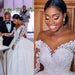 Elegant custom wedding gown by Ancient Energy featuring intricate lace details and a flowing train for bridal elegance.