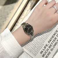 Elegant ladies steel-band wristwatch by Ancient Energy, featuring a polished metal strap and classic round dial.