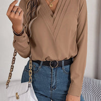 Ancient Energy women's V-neck long sleeve blouse, solid design, suitable for office and professional wear.