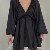 Elegant V-neck lantern sleeve dress for women by Ancient Energy, featuring a stylish fit and flowing fabric.