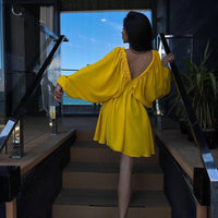 Elegant women's V-neck lantern sleeve dress by Ancient Energy, featuring stylish sleeves and a flattering fit.