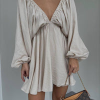 Elegant women's V-neck lantern sleeve dress by Ancient Energy, featuring a stylish fit and flowy fabric for a fashionable look.