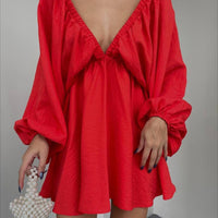 Elegant women’s V-neck lantern sleeve dress by Ancient Energy, featuring a fashionable design and flowing fabric.