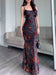 Ancient Energy black flocked strappy maxi dress with a flowing silhouette and intricate textured fabric.