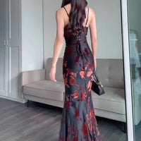 Ancient Energy flocked strappy maxi dress in black, featuring a fitted bodice and flowing skirt, perfect for elegant occasions.