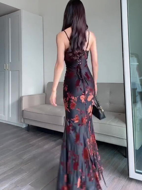 Ancient Energy flocked strappy maxi dress in black, featuring a fitted bodice and flowing skirt, perfect for elegant occasions.