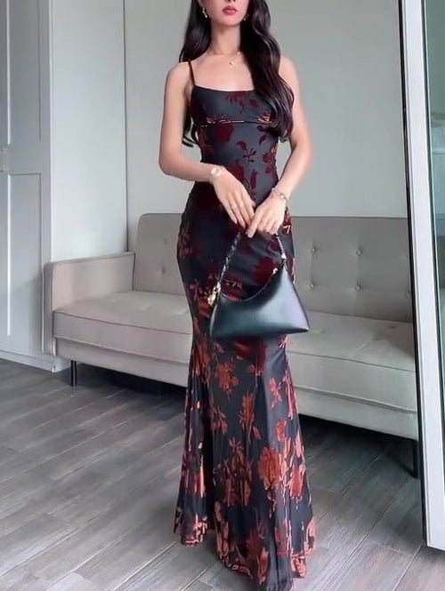 Ancient Energy flocked strappy maxi dress in black, featuring a fitted bodice and flowing skirt, stylish evening wear.
